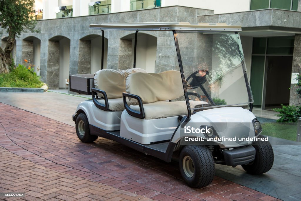 Electric golf car in the summer resort